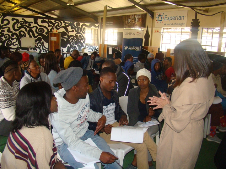 Facilitator Mrs Khatoon Gani engaging with the participants in the workshop